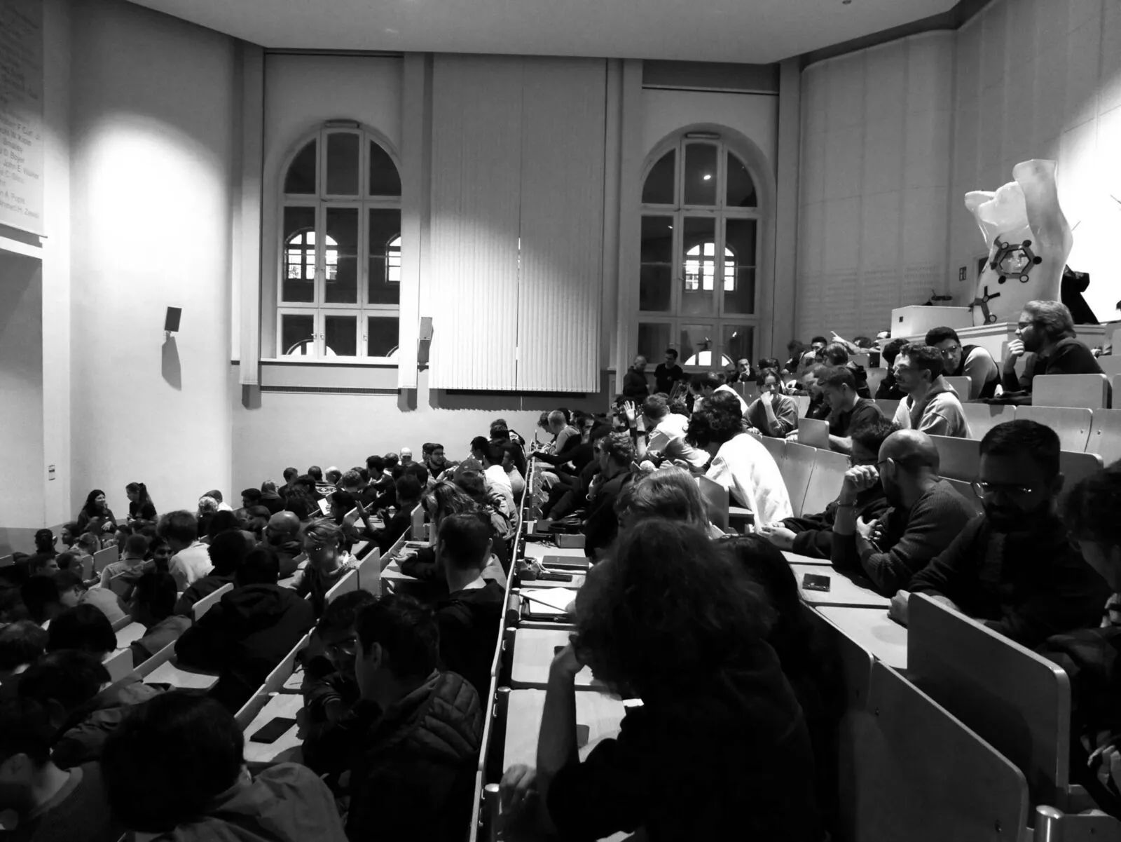 Full lecture hall at Federico Barbero's talk, the first of the semester
